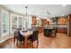 Eat-in dining area has a table, wood floors, and a window with backyard view at 893 Paces Farm Sw Trl, Marietta, GA 30064