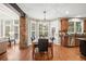 Bright eat-in dining area features natural lighting, backyard views, and a modern chandelier at 893 Paces Farm Sw Trl, Marietta, GA 30064