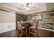Basement dining area featuring a custom table, modern flooring, and an accent wall at 893 Paces Farm Sw Trl, Marietta, GA 30064