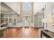 Inviting foyer with soaring ceilings, hardwood floors, and abundant natural light streaming through large windows at 893 Paces Farm Sw Trl, Marietta, GA 30064