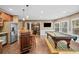 Large game room with pool table, stainless steel refrigerator and dining area at 893 Paces Farm Sw Trl, Marietta, GA 30064