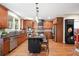 Kitchen boasts custom cabinetry, stainless steel appliances, and an island with seating at 893 Paces Farm Sw Trl, Marietta, GA 30064