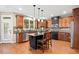 Gourmet kitchen features stainless appliances, wood cabinets, and a breakfast bar at 893 Paces Farm Sw Trl, Marietta, GA 30064