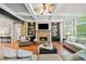 Open living room features hardwood floors, coffered ceilings, fireplace and built-in shelving at 893 Paces Farm Sw Trl, Marietta, GA 30064