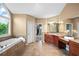 Spa-like main bathroom with soaking tub, dual sinks, and walk-in closet at 893 Paces Farm Sw Trl, Marietta, GA 30064