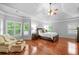 Bright main bedroom featuring hardwood floors, lots of natural light, and tray ceiling at 893 Paces Farm Sw Trl, Marietta, GA 30064