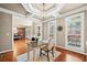 Elegant office space featuring hardwood floors, plantation shutters, and an open view into the dining room at 893 Paces Farm Sw Trl, Marietta, GA 30064