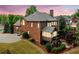 Brick home featuring a screened porch, back yard, 3-car garage, and stone landscaping with outdoor fireplace at 893 Paces Farm Sw Trl, Marietta, GA 30064