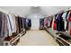 Spacious walk-in closet with ample hanging space and shelving, offering great storage solutions and natural light at 893 Paces Farm Sw Trl, Marietta, GA 30064