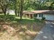 Charming single-story home with a red door, attached garage and a cozy front yard at 3190 Grand Central Dr, Snellville, GA 30078