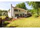 Spacious backyard featuring a patio, lawn, and lush landscaping at 3545 River Summit Trl, Duluth, GA 30097