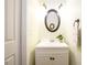 Charming half bathroom features a vanity with storage and stylish decor at 3545 River Summit Trl, Duluth, GA 30097