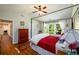 Primary bedroom with wood floors, a vaulted ceiling, and natural light at 3545 River Summit Trl, Duluth, GA 30097