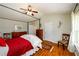 Vaulted ceiling bedroom with canopy bed, and a chair in front of the window at 3545 River Summit Trl, Duluth, GA 30097
