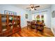 Traditional dining room boasts natural light, hardwood floors, and classic china cabinet at 3545 River Summit Trl, Duluth, GA 30097