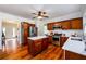 Updated kitchen provides island, stainless appliances, and open layout to dining area at 3545 River Summit Trl, Duluth, GA 30097