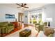 Spacious living room with hardwood floors, large windows, and an open layout at 3545 River Summit Trl, Duluth, GA 30097