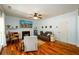 Cozy living room features a fireplace, hardwood floors, and neutral paint at 3545 River Summit Trl, Duluth, GA 30097
