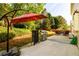 Backyard area with outdoor seating, lush greenery, and grilling area at 3545 River Summit Trl, Duluth, GA 30097