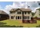 Exterior of house overlooking an expansive backyard with a deck perfect for outdoor enjoyment at 36 Evergreen Way, Dallas, GA 30157