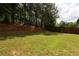 View of the backyard showcasing the lush greenery and natural surroundings at 36 Evergreen Way, Dallas, GA 30157
