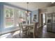 Bright breakfast nook featuring a white table, backyard views, and an elegant chandelier at 36 Evergreen Way, Dallas, GA 30157