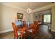 Traditional dining room with hardwood floors, white trim, and chandelier at 36 Evergreen Way, Dallas, GA 30157