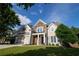 Beautiful two-story home with stone details, a well-kept lawn, and a convenient two-car garage at 36 Evergreen Way, Dallas, GA 30157