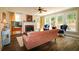 Cozy living room with a fireplace, large windows, and hardwood floors at 36 Evergreen Way, Dallas, GA 30157