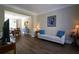 Spacious living room with hardwood floors, comfortable seating, and a view into the dining area at 36 Evergreen Way, Dallas, GA 30157