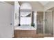 Spacious main bathroom featuring a soaking tub with window and a separate glass shower at 36 Evergreen Way, Dallas, GA 30157