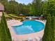 An inviting swimming pool surrounded by lush greenery and lounge chairs offers a relaxing outdoor experience at 36 Evergreen Way, Dallas, GA 30157