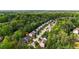 Aerial view of house surrounded by wooded neighborhood and close to city amenities at 6859 Winding Wade Trl, Austell, GA 30168