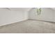 Finished attic with neutral carpet, a window overlooking a residential neighborhood, and white walls at 6859 Winding Wade Trl, Austell, GA 30168