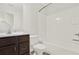 Cozy bathroom featuring a vanity, sink, toilet, and a bathtub with white tile at 6859 Winding Wade Trl, Austell, GA 30168