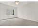 Empty bedroom with window and plush carpet at 6859 Winding Wade Trl, Austell, GA 30168