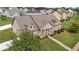 Lovely aerial view of home with a well-manicured front lawn in a residential area at 1129 Abundance Dr, Locust Grove, GA 30248