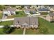 Aerial view of home with manicured lawn, mature trees and lovely landscaping at 1129 Abundance Dr, Locust Grove, GA 30248