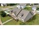Charming home with beautiful landscaping and an inviting front porch at 1129 Abundance Dr, Locust Grove, GA 30248