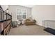 Versatile room with neutral carpet, large window, and built-in shelving for use as a bedroom or office at 1129 Abundance Dr, Locust Grove, GA 30248