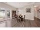 Cozy dining area with hardwood floors, ample natural light, and a traditional dining set at 1129 Abundance Dr, Locust Grove, GA 30248