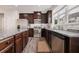 Well-equipped kitchen with dark cabinetry, stainless steel appliances, granite countertops, and a stylish backsplash at 1129 Abundance Dr, Locust Grove, GA 30248