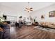 Open-concept living room boasts hardwood floors, high ceilings, and a seamless flow into the kitchen at 1129 Abundance Dr, Locust Grove, GA 30248
