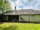 Back exterior view of home featuring vinyl siding and mature trees at 1528 Buckingham Pl, Stockbridge, GA 30281