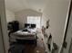 View of the bedroom, showing peeling paint, mattress, and a window for natural light at 1528 Buckingham Pl, Stockbridge, GA 30281