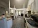 Kitchen with natural light, outdated appliances, and an adjoining dining area at 1528 Buckingham Pl, Stockbridge, GA 30281