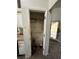 Damaged kitchen pantry with metal shelving and some kitchen clutter at 1528 Buckingham Pl, Stockbridge, GA 30281