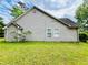 Exterior side view of the home featuring vinyl siding at 1528 Buckingham Pl, Stockbridge, GA 30281