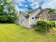 Home exterior showcasing vinyl siding and well maintained lawn at 1528 Buckingham Pl, Stockbridge, GA 30281