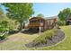 Expansive backyard featuring a deck, patio, and well-maintained lawn, perfect for entertaining at 1670 Bookhout Dr, Cumming, GA 30041